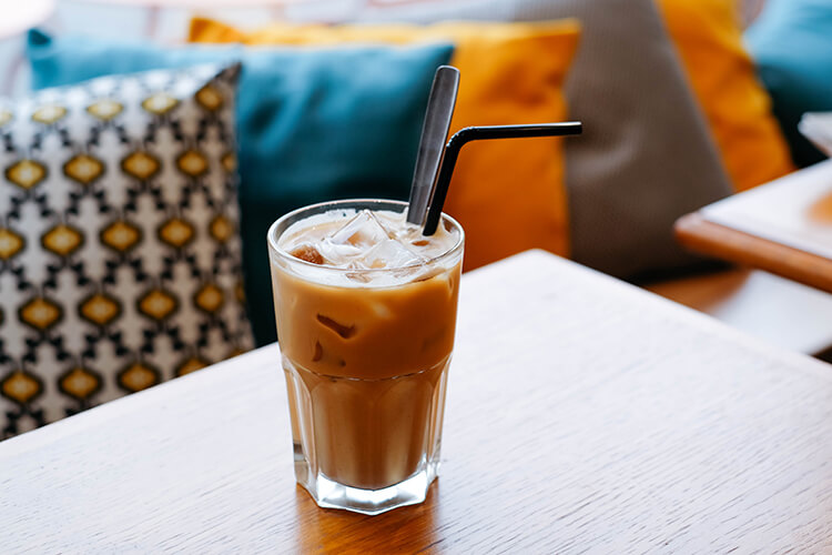 iced coffee on a table with straw